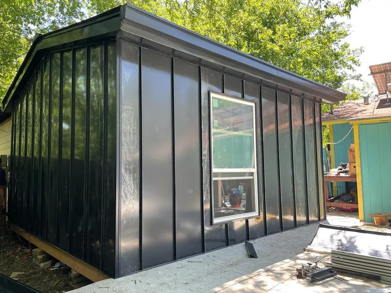 Black standing seam metal wall panels for Roof Inspection in Mashpee